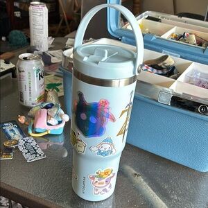 Light Blue Tumbler with Stickers
